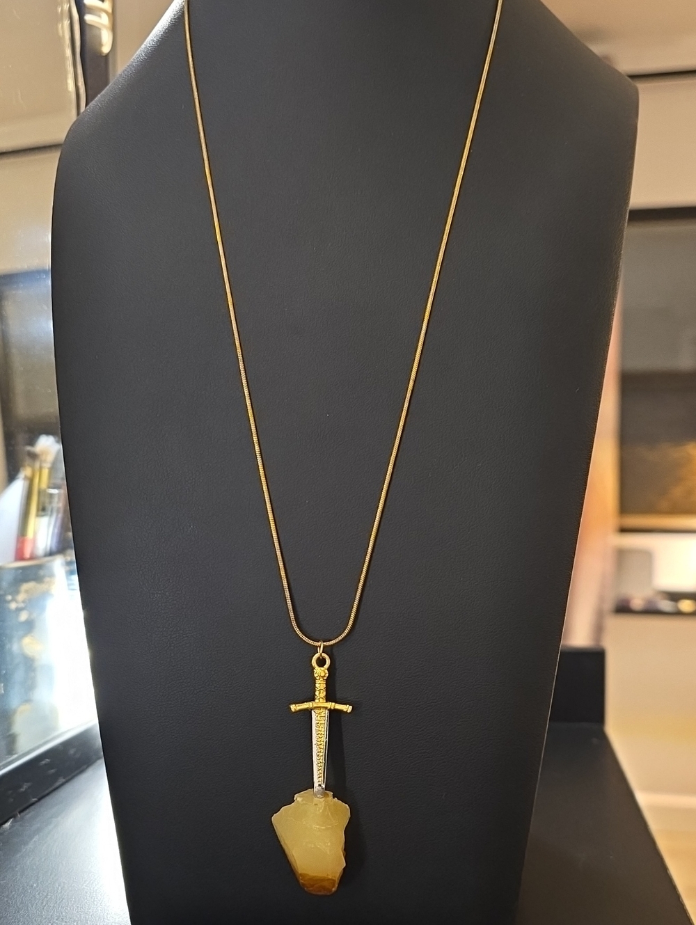 Gold Sword Pendant Necklace with Amber Stone